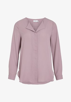 Šviesiai rožinė ilgomis rankovėmis bliuska su smailiu apykakle, mygtukų užsegimu priekyje ir išlenktu apačiu. Lygi medžiaga; paprastas, švarus dizainas be raštų.