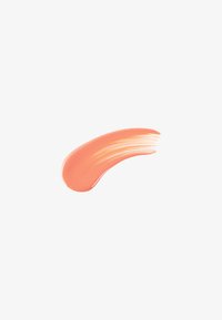 Coral-colored cream with a smooth, glossy texture, shaped in an elongated curve, featuring subtle streaks for depth.