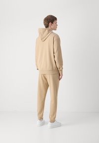 HUGO NALONSO - Sportska majica - medium beige