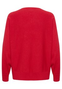 Sweater rosso lavorato a maglia con scollo rotondo, maniche lunghe e vestibilità ampia. Presenta polsini e orlo a coste e una texture liscia.