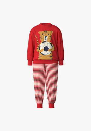 Red pajama set featuring a long-sleeve top with a tiger graphic holding a soccer ball and striped red and white pants with elastic cuffs.
