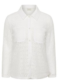 Blouse blanche à manches longues en dentelle avec col, boutons sur le devant et deux poches poitrine présentant un délicat motif géométrique.