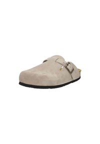 Beige suede clog with an open back, featuring a single adjustable buckle strap and a textured black rubber sole.
