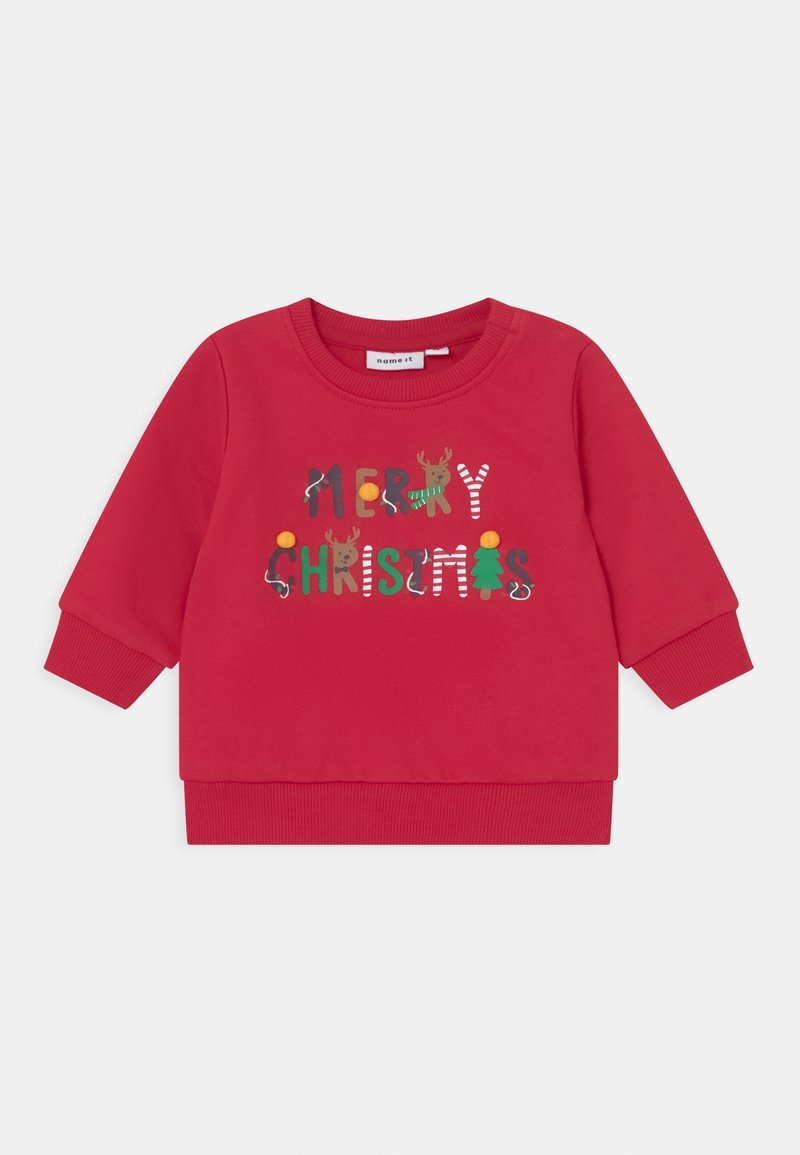 Sweatshirt rouge pour enfants avec texte "Joyeux Noël" décoré de rennes, sapin de Noël, canne en sucre d'orge et guirlandes festives.