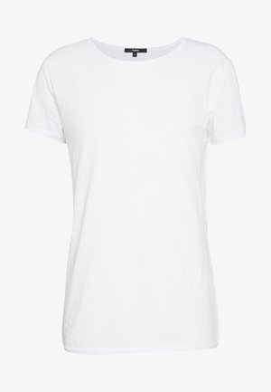 Camiseta blanca de manga corta con cuello redondo y una etiqueta negra en el interior detrás del cuello, talla mediana.