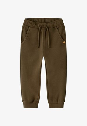 Brune vaffelstrikkede børnebukser med elastisk linning, snor, sidelommer og ribkant ved anklerne.