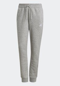 Grijze joggerbroeken van zacht materiaal, met een elastische tailleband met trekkoord, geribbelde boorden en een wit logo op de linker dij.
