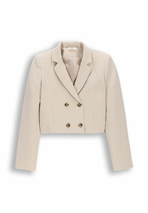 Beżowa krótka dwurzędowa marynarka z długimi rękawami i klapami z wycięciem, z czterema metalowymi guzikami z przodu.