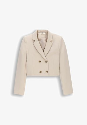 Beżowa krótka dwurzędowa marynarka z długimi rękawami i klapami z wycięciem, z czterema metalowymi guzikami z przodu.
