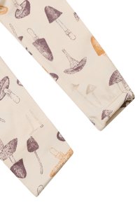Beige Leggings mit Pilzmuster. Mit dunkelbraunen, hellbraunen und orangefarbenen Pilzillustrationen. Aus weichem Baumwollmaterial.
