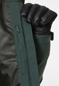 Helly Hansen NORA SHORT PUFFY - Chaqueta de snowboard - darkest spruce