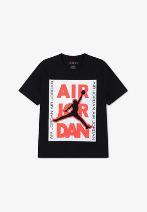 Black cotton T-shirt featuring a bold white and red graphic of "AIR JORDAN" and a silhouette of a jumping figure. Round neck design.