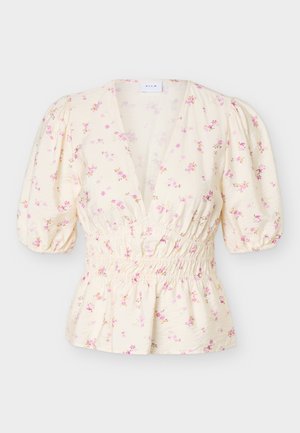 Κρεμ μπλούζα με ροζ και κίτρινο λουλουδάτο μοτίβο, φουσκωτά κοντά μανίκια, βαθύ V-λαιμόκοψη και διακοσμητική ελαστική μέση.