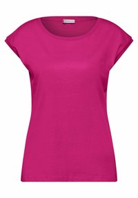 Fuchsiové bavlněné tričko s kulatým výstřihem, krátkými rukávy a volným střihem. Má hladkou texturu a logo štítek na límci.