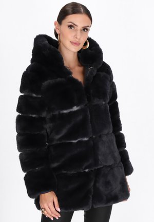 Black faux fur puffer jacket with a hood, featuring a quilted design, plush texture, and front button closure. Accentuated by wide sleeves.