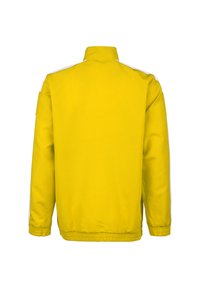 Gelbe Jacke mit hohem Kragen, versehen mit weißen Akzentstreifen an den Schultern, elastischen Bündchen und einem taillierten Saum. Glatte Textur.