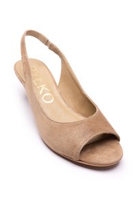 Beežist seemisnahast avatud varbaga sling-tüüpi jalanõu ümarate vormide ja pehmendusega tallaga. Omadab väikest kontsa ja kuldset brändilogot tallal.