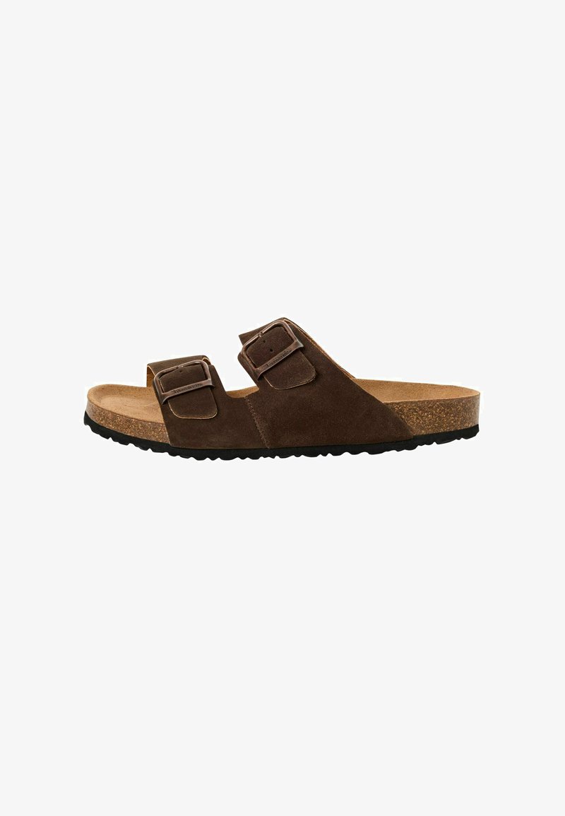 Bruna mockaskinnssandaler har två justerbara remmar med spännen, en korkfotbädd och en strukturerad svart gummisula.