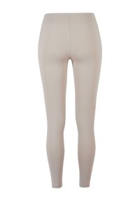 Bež helanke s glatkom teksturom i dizajnom pune duljine. Imaju visok pojas i nemaju vidljive šavove. Pogodne za casual ili sportsko nošenje.