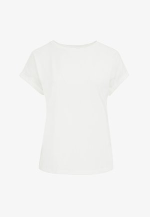 Valge lühikeste varrukatega T-särk ümmarguse kaelusega, valmistatud siledast kangast. Omab rullitud varrukaotsi ja vabalt lasuvat lõiget.