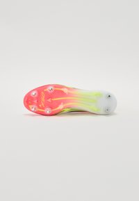 F50 soccer cleat featuring a translucent white upper, pink-and-yellow sole with five cleats, and mesh-like texture for breathability.