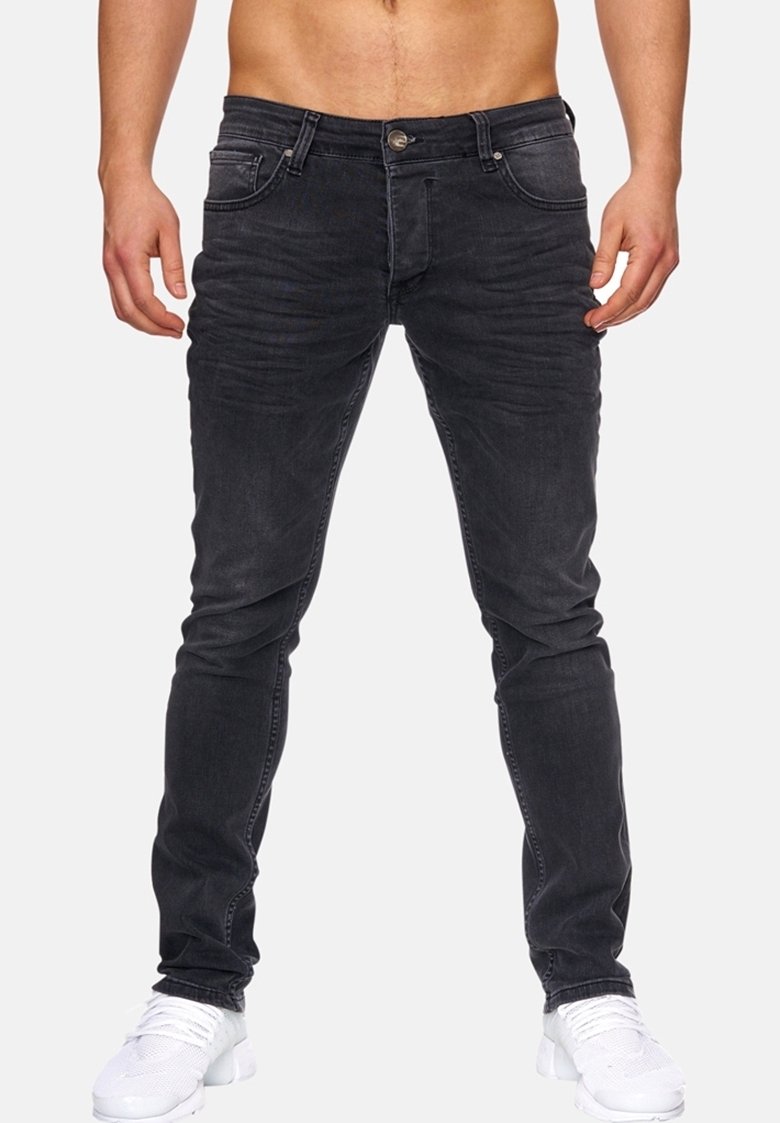Černé skinny džíny vyrobené z denimu s vytřeným vzhledem. Mají pět kapes, zapínání na knoflík a jemné švy.