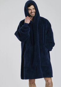 Marinblå hættetrøje i fleece med oversized pasform, lange ærmer, lomme foran og blød tekstur. Velegnet til afslappet indendørs brug.