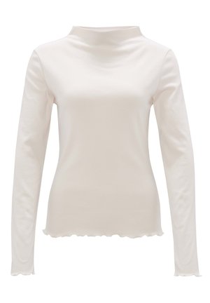 Langmouw, hoge hals top van zacht witte stof, met een scalloped zoom en een aansluitend ontwerp. Gladde textuur zonder patronen.