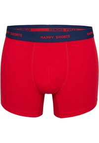 Röda boxershorts med blå elastisk midjeresår som har texten "HAPPY SHORTS". Tillverkade av mjuk bomull som framhäver den släta texturen och den figurnära formen.