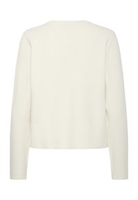 Bela dolga majica s dolgimi rokavi in okroglim izrezom. Mehka, minimalistična zasnova. Ima gladko teksturo in ohlapen, skrajšan kroj v pasu.