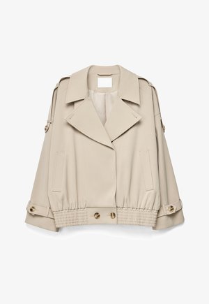 Beige cropped trenchcoat met brede revers, met knopen gesloten manchetten, elastische zoom met schildpadsknopen en voorzakken met bies.