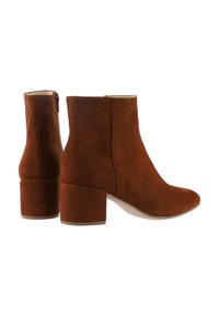 Pair of brown suede ankle boots with block heels and side zippers, shown from side and back angles on white background.