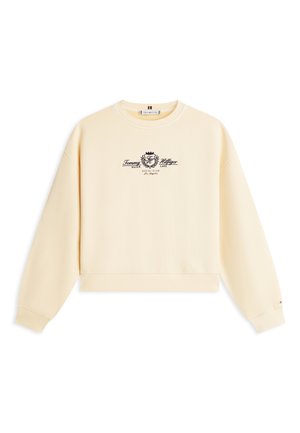 Krēmkrāsas džemperis ar garām piedurknēm, apaļu kakla izgriezumu un centrālu melnu logotipu un tekstu "Tommy Hilfiger Silver Lake Social Club Los Angeles."