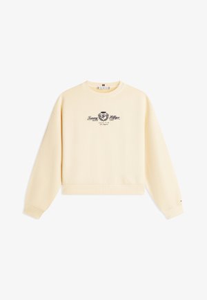 Sudadera de color crema con mangas largas, cuello redondo y logotipo negro central junto con el texto que dice "Tommy Hilfiger Silver Lake Social Club Los Ángeles."