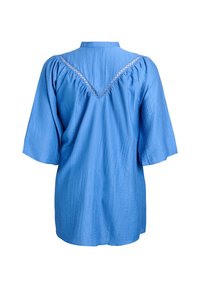 Blue shirt with short, wide sleeves, featuring a textured fabric and a decorative back yoke with a V-shaped cutout and lace trim.