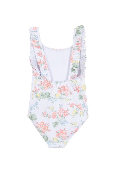 Maillot de bain une pièce blanc avec un motif floral en rose, bleu et vert. Il présente des bretelles volantées et un dos en forme de scoop.