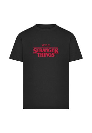 Maglietta nera in cotone con grafica rossa sulla parte anteriore con la scritta "NETFLIX STRANGER THINGS". Girocollo, maniche corte, vestibilità classica.