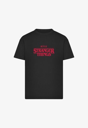 Maglietta nera in cotone con grafica rossa sulla parte anteriore con la scritta "NETFLIX STRANGER THINGS". Girocollo, maniche corte, vestibilità classica.