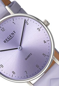 Quartz watch with a lavender metallic dial, silver hour markers, black hands, and a lavender leather strap. Features a simple round case.