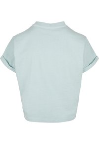 T-shirt court bleu clair avec manches courtes retroussées et col rond, montré de dos sur fond blanc.