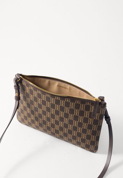Brown patterned clutch purse with gold zipper and brown leather strap. Features a checkerboard design with logo accents on the material.