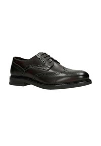 Zwarte leren nette schoen met brogue-details, vetersluiting en een ronde neus. Voorzien van een rubberen zool met een lichte hak.