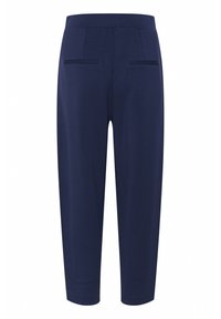 Navy blue tapered trousers made from a soft fabric, featuring two back pockets and a mid-rise waistband. Smooth texture and relaxed design.