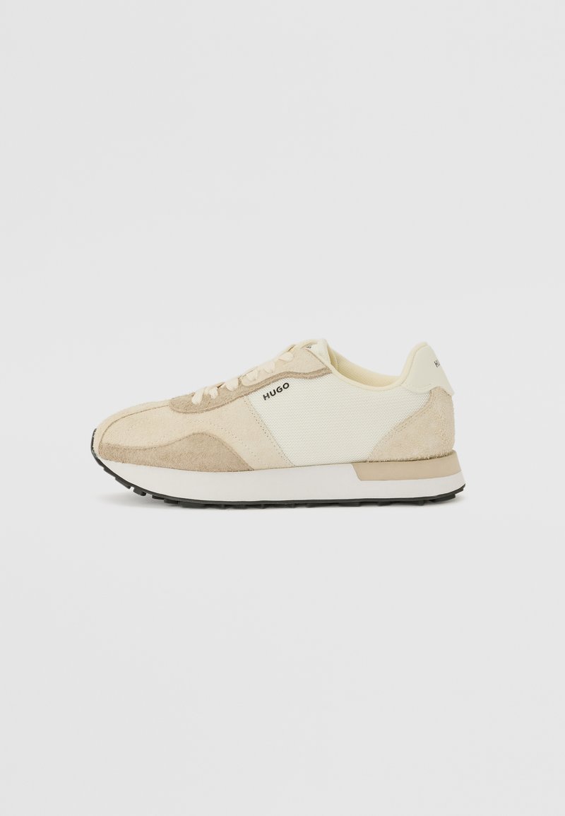 Beige sneakers with textured suede and mesh panels, featuring a white sole and light laces. Marked with "HUGO" on the side.