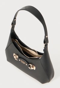 Black faux leather handbag with a curved shape, a single strap, and a gold-tone clasp detail. Features a zipper compartment and a branded logo.