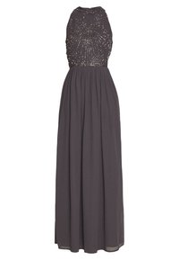 Lång grå klänning med en figursydd bärnstensbeströdd överdel med en solstråledesign som sträcker sig ner till en flödande kjol. Tillverkad av lättviktig tyg.