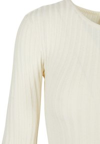 Ribbed long-sleeve top in light beige. Soft texture with a round neckline. Vertical stripes throughout the fabric. Seam detailing visible.