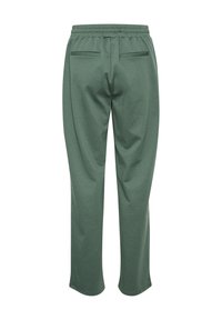 Pantalons de jogging légers et verts avec une taille élastique, deux poches arrière et une coupe droite. Texture douce et coupe décontractée.