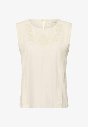 Blusa sin mangas color crema con escote redondo, bordado floral sutil en el pecho y cierre con lazo en la parte trasera.