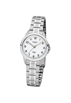 Montre-bracelet en métal argenté avec cadran blanc, chiffres noirs, trois aiguilles et bracelet à maillons, affichant l'heure 10:09:36.